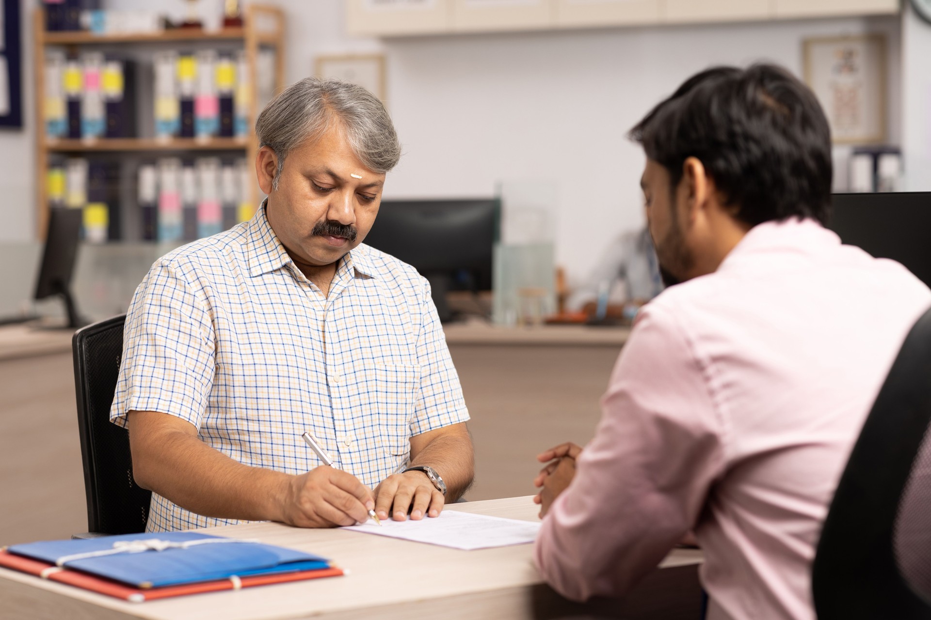 Professional with Client stock photo